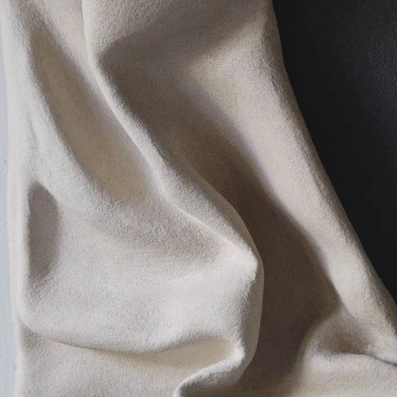 Close-up of beige fabric with shadows