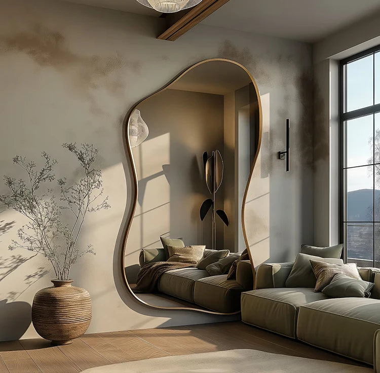 Modern living room with a large, stylish mirror and a comfortable sofa.