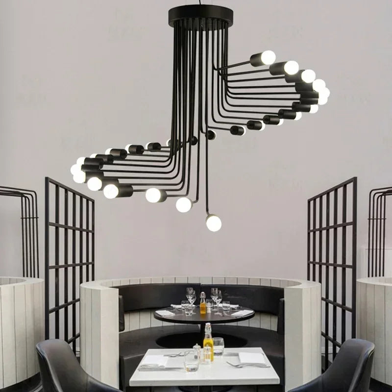 Modern Nordic black spiral LED chandelier with multi-head iron hanging lights suspended above a luxury dining space, creating an elegant contemporary ambiance.