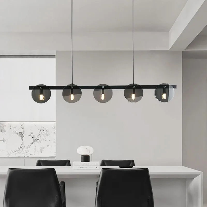 Modern Nordic black glass ring LED chandelier hanging in luxury living room interior with contemporary pendant lighting design