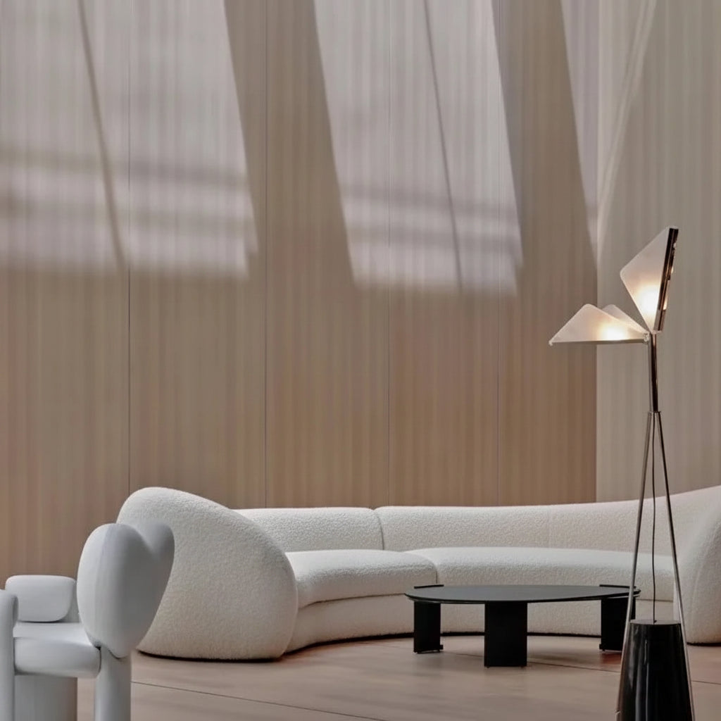 Modern living room with a white sofa, coffee table, and floor lamp.