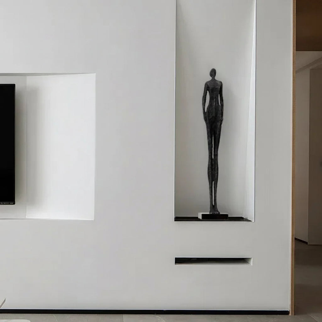 Black sculpture on a white pedestal against a white wall with 'FOSUHOUSE' branding.