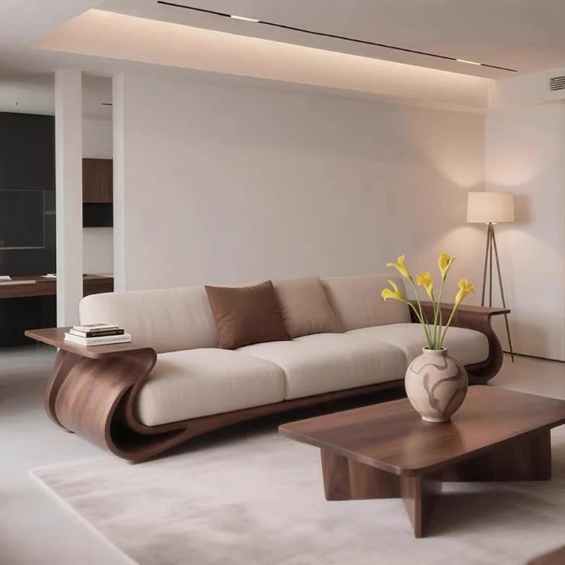 Modern living room with a beige sofa, wooden coffee table, and decorative vase.