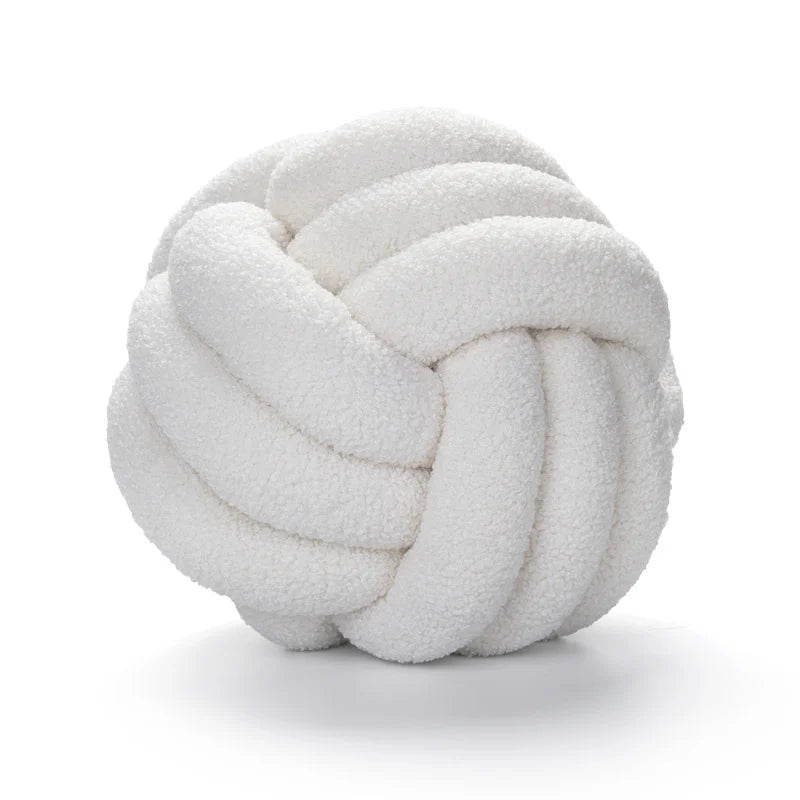 White knot pillow on a white background