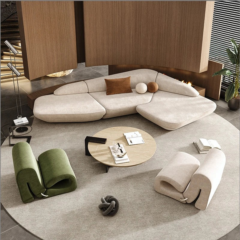 Modern living room with a sectional sofa, armchair, and coffee table.