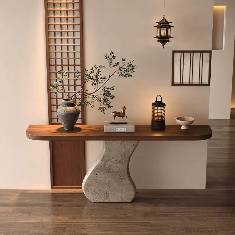 Wooden console table with decorative items in a modern interior setting