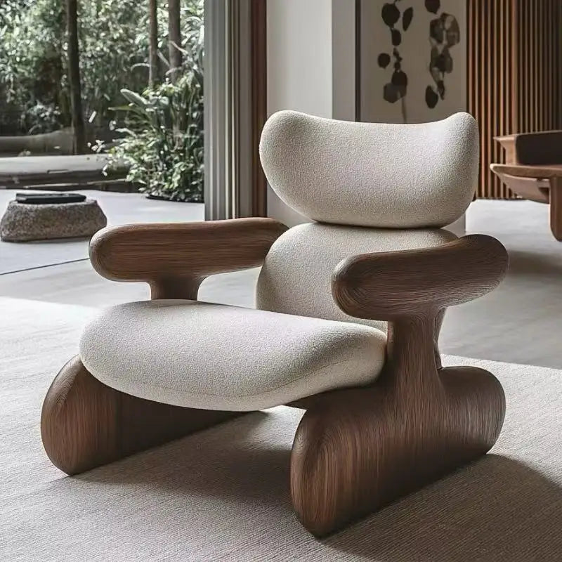 Modern chair with wooden legs and beige cushioned seat in a room with plants and artwork.