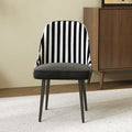 Chair with black and white striped backrest and gray seat in a room with wooden furniture.