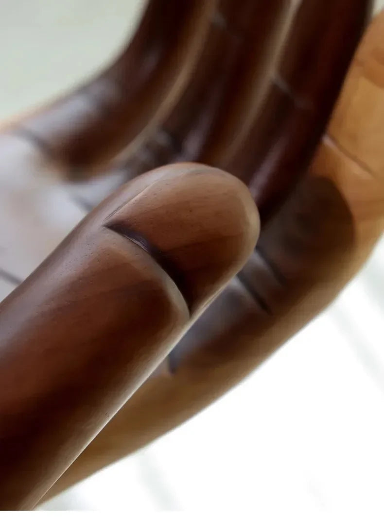 Close-up of a wooden ring on a hand with a blurred background