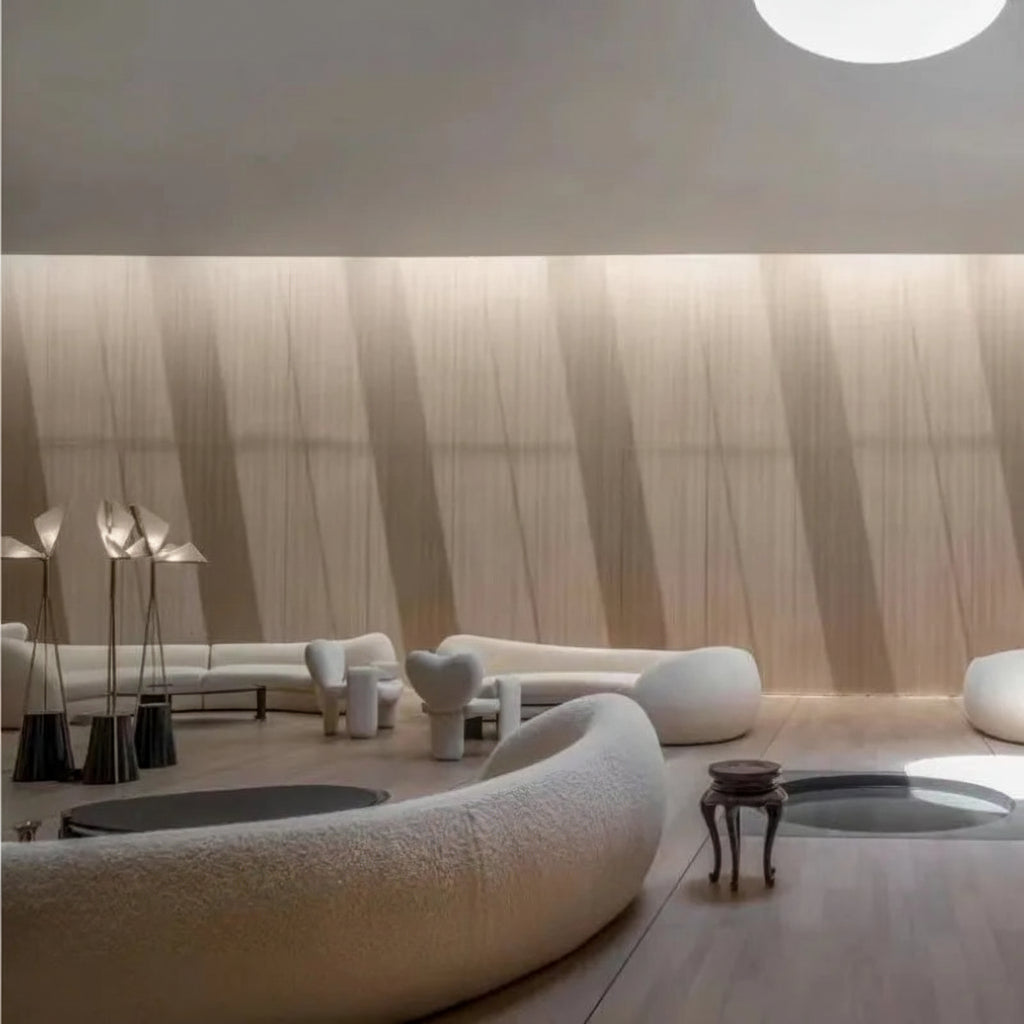 Modern interior design with white furniture and floor lamps in a room with a textured wall.