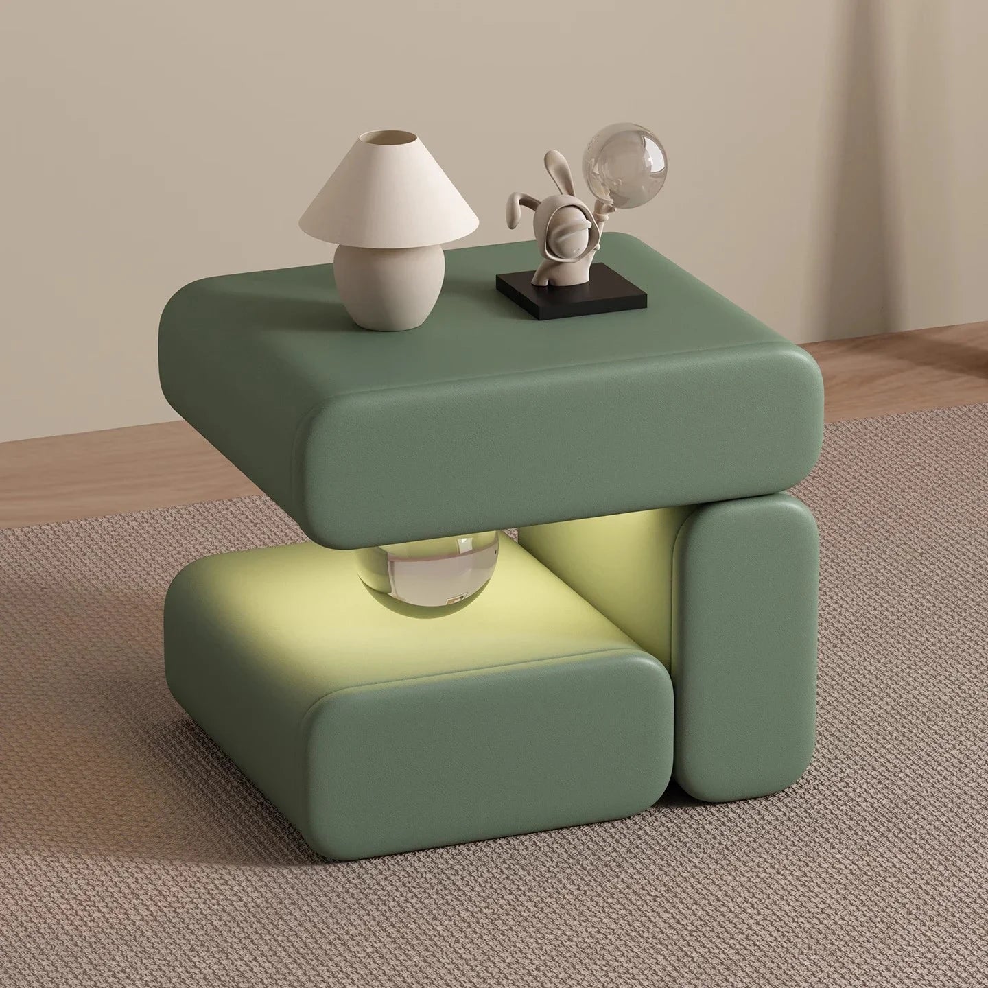 Green side table with decorative items on a neutral background