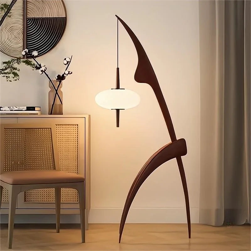 Modern wooden chair in a room with a lamp and decor