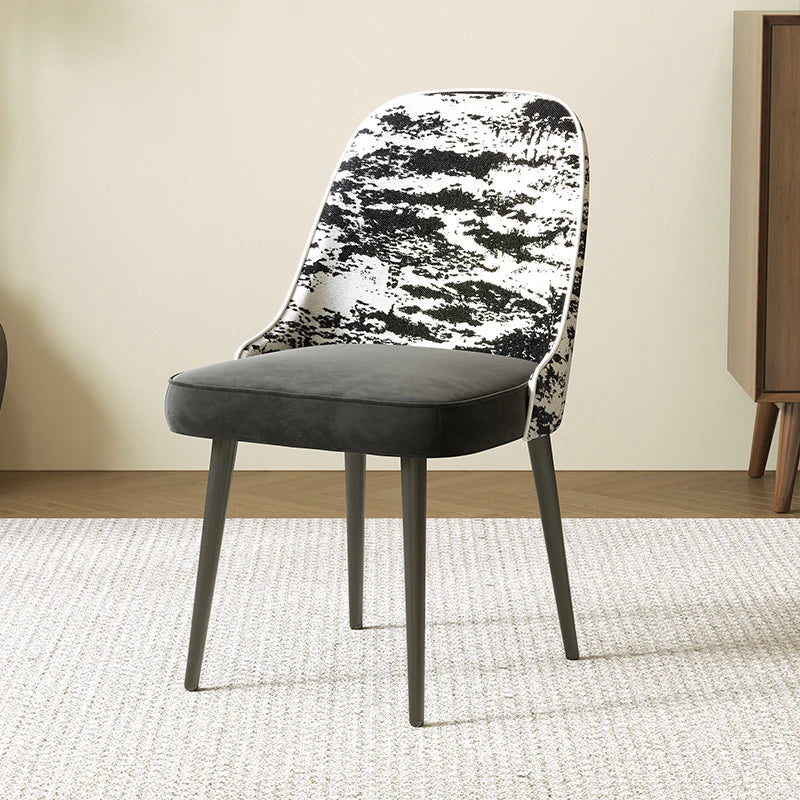 Chair with black and white patterned backrest in a room setting