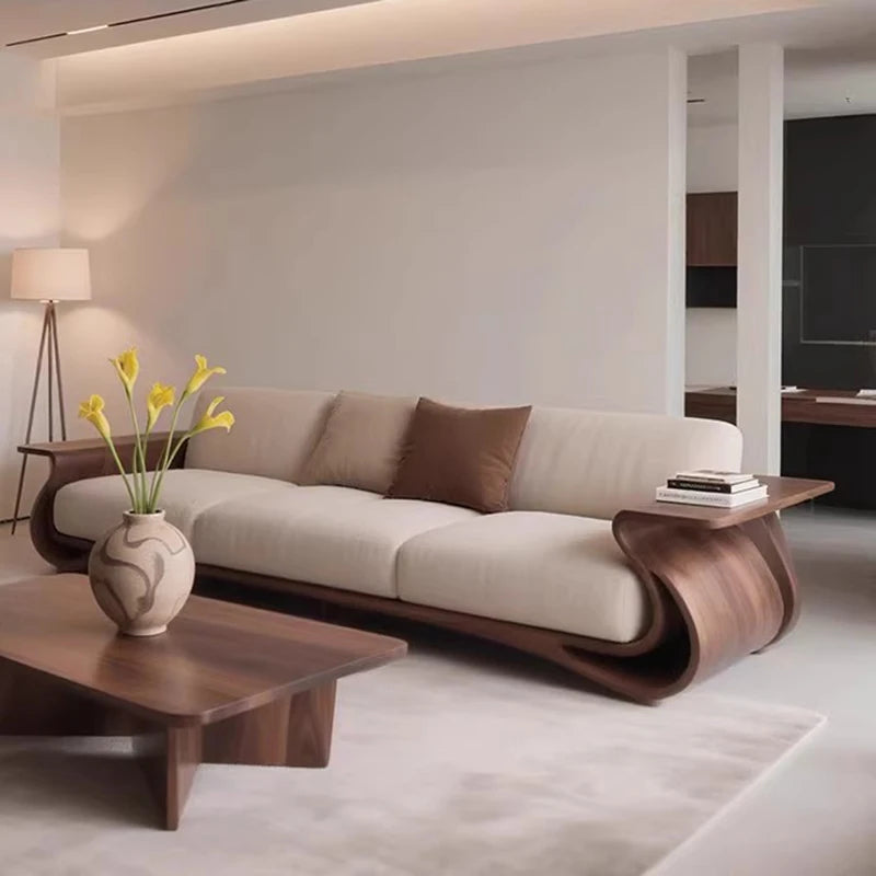 Modern living room with a stylish beige sofa and wooden coffee table.