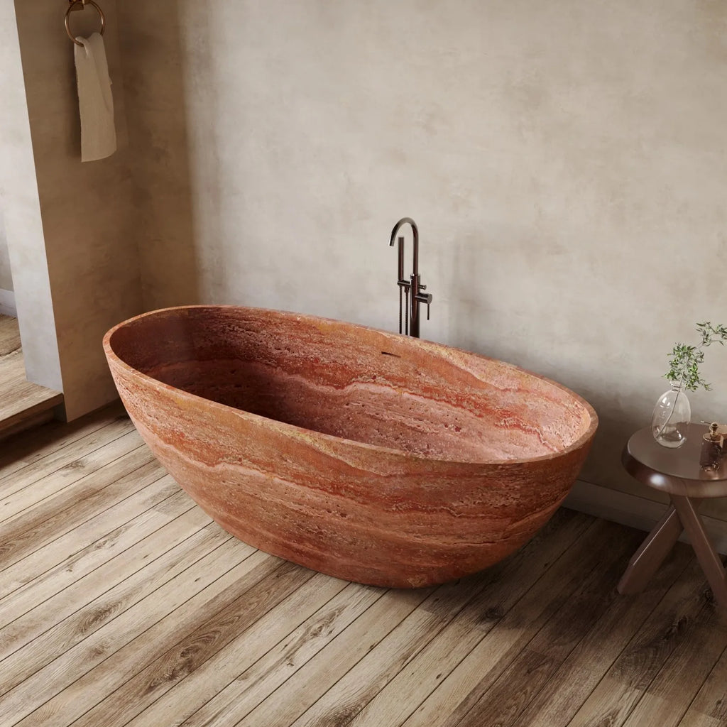 Stylish freestanding bathtub made of terracotta on a wooden floor with a neutral wall background.