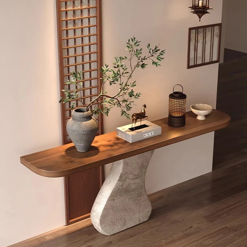 Wooden console table with decorative items in a room setting