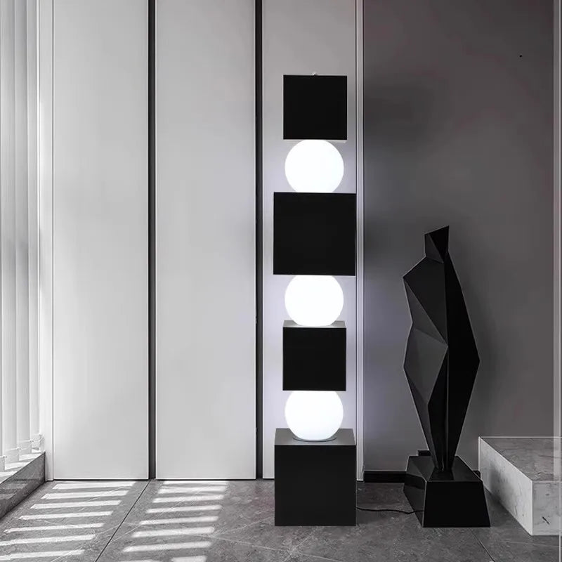 Modern floor lamp with geometric design in a minimalistic room.
