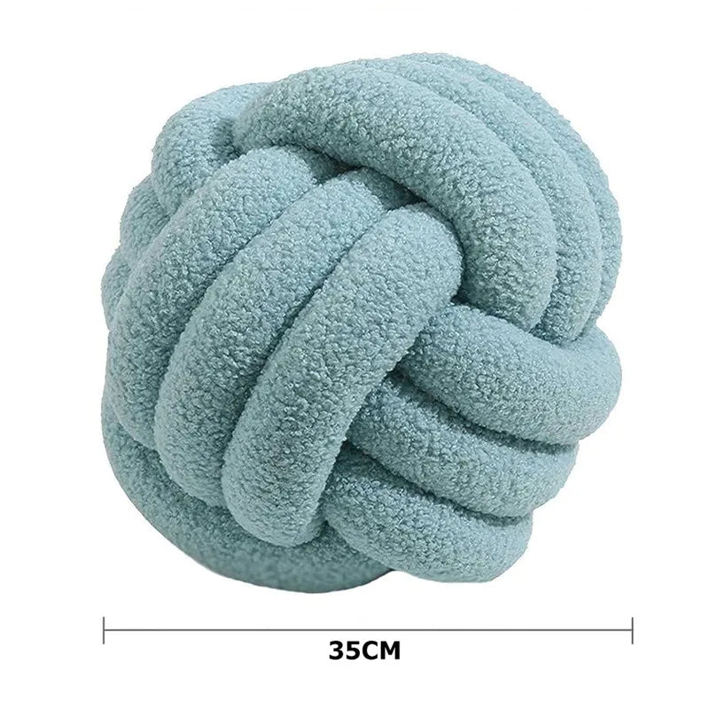 Blue knotted plush toy with measurement label on a white background