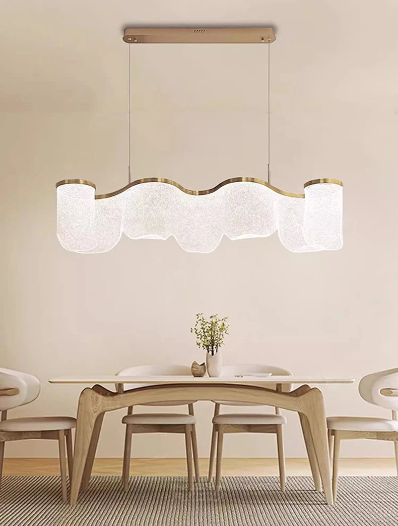 Modern dining room with a stylish pendant light fixture.