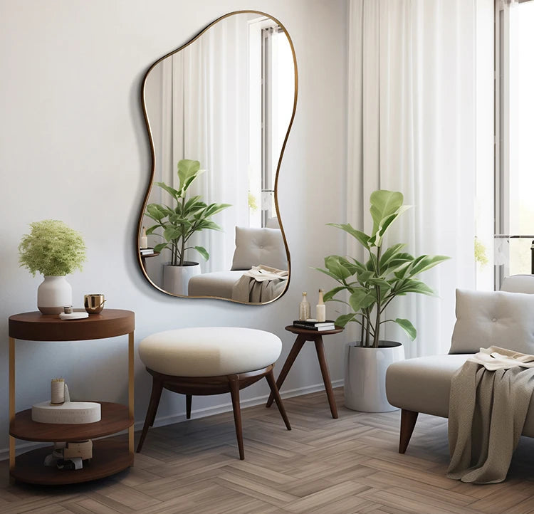 Modern living room with a large decorative mirror, plants, and wooden furniture.