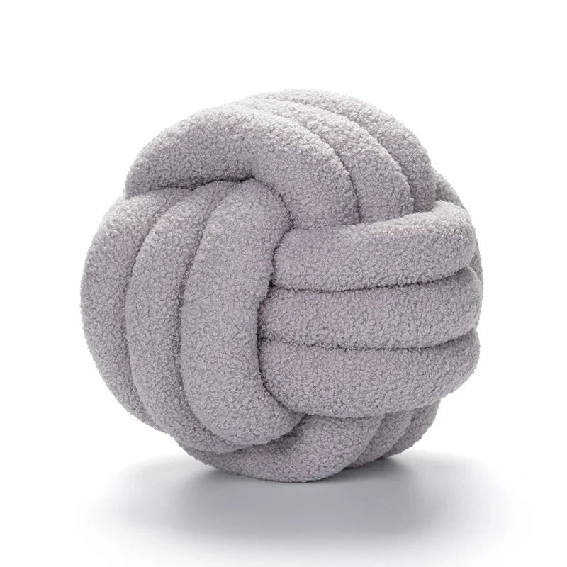 Gray knotted fabric ball on a white background