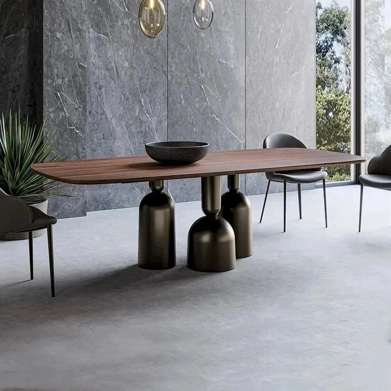 Modern dining table with unique base design in a minimalistic room.