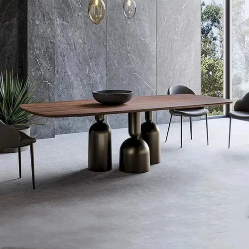 Modern dining table with unique base design in a minimalistic room.