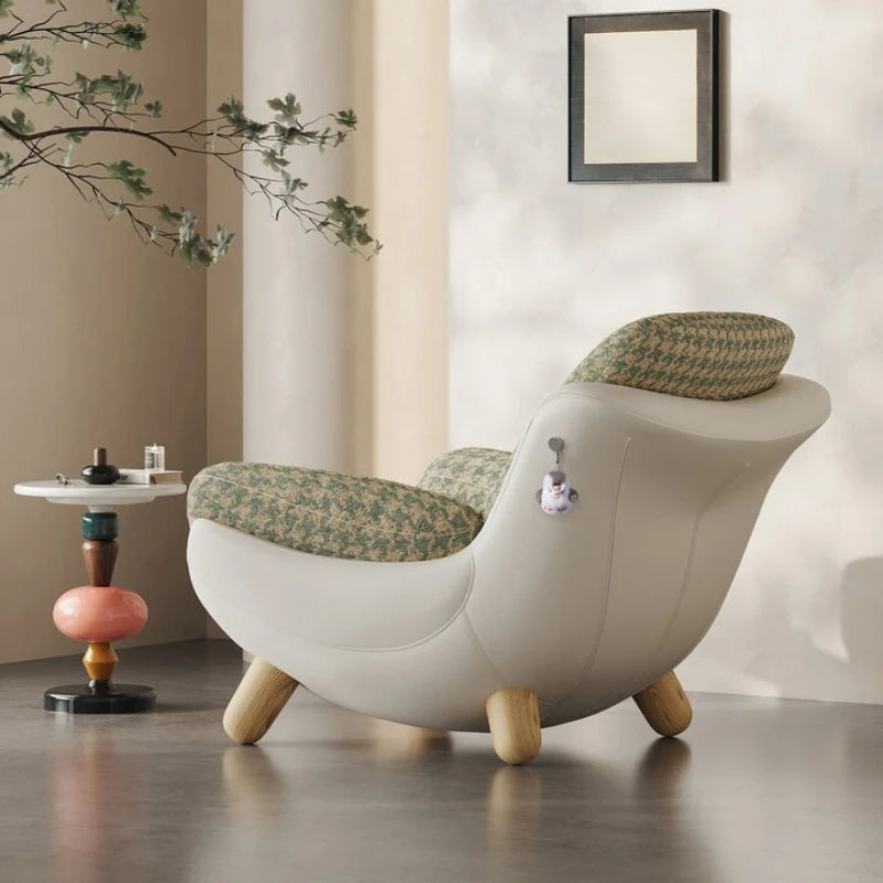 Modern chair with floral-patterned cushion in a minimalistic room