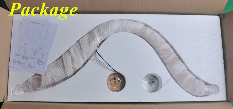 Fishing rod packaging with accessories on a white surface