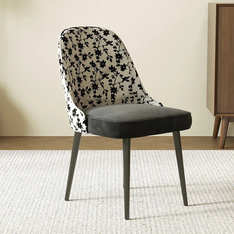 Chair with floral-patterned backrest and solid seat in a room setting