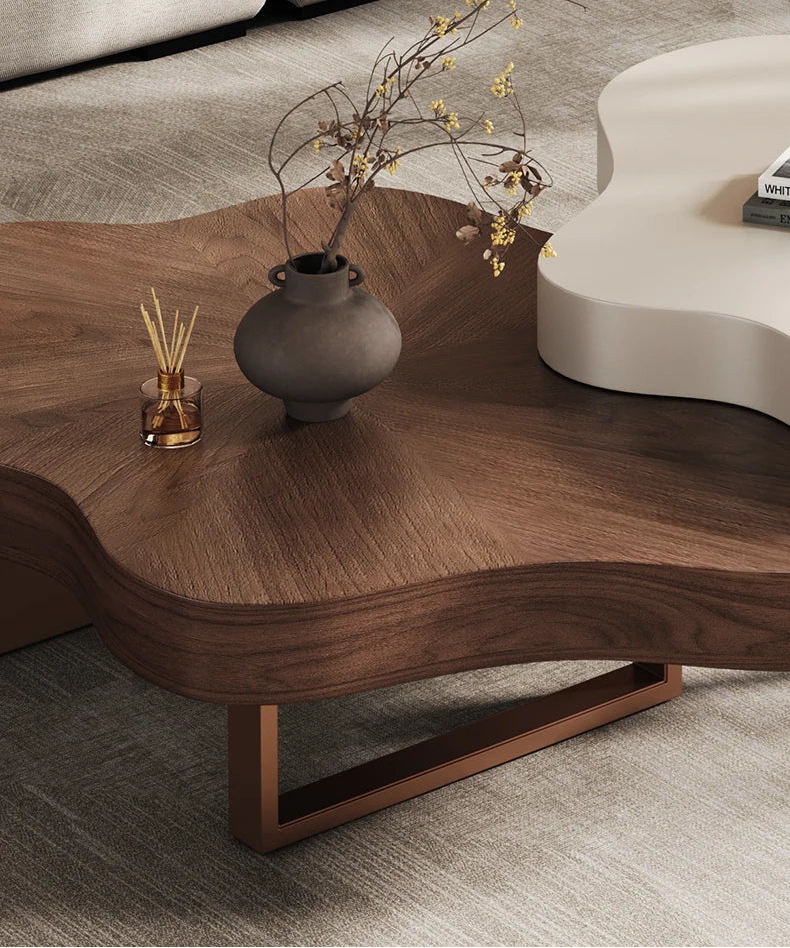 Wooden coffee table with decorative items on a light gray background