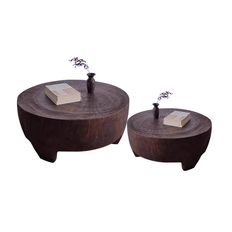 Two wooden coffee tables with decorative items on a white background