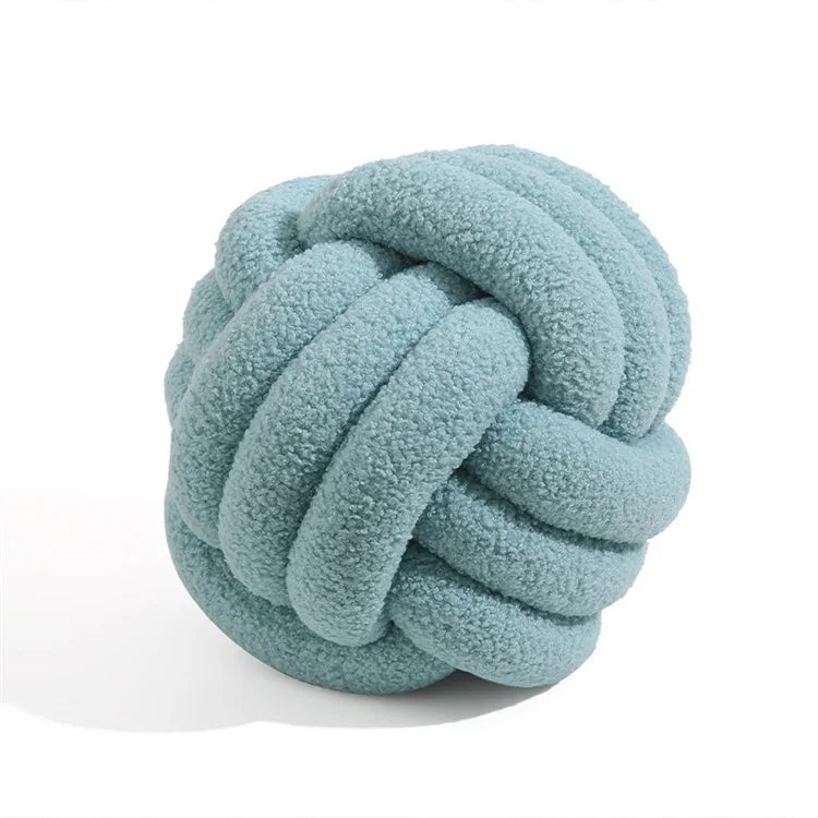Blue knotted toy on a white background