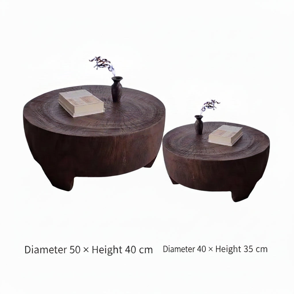 Two wooden coffee tables with decorative items on a white background