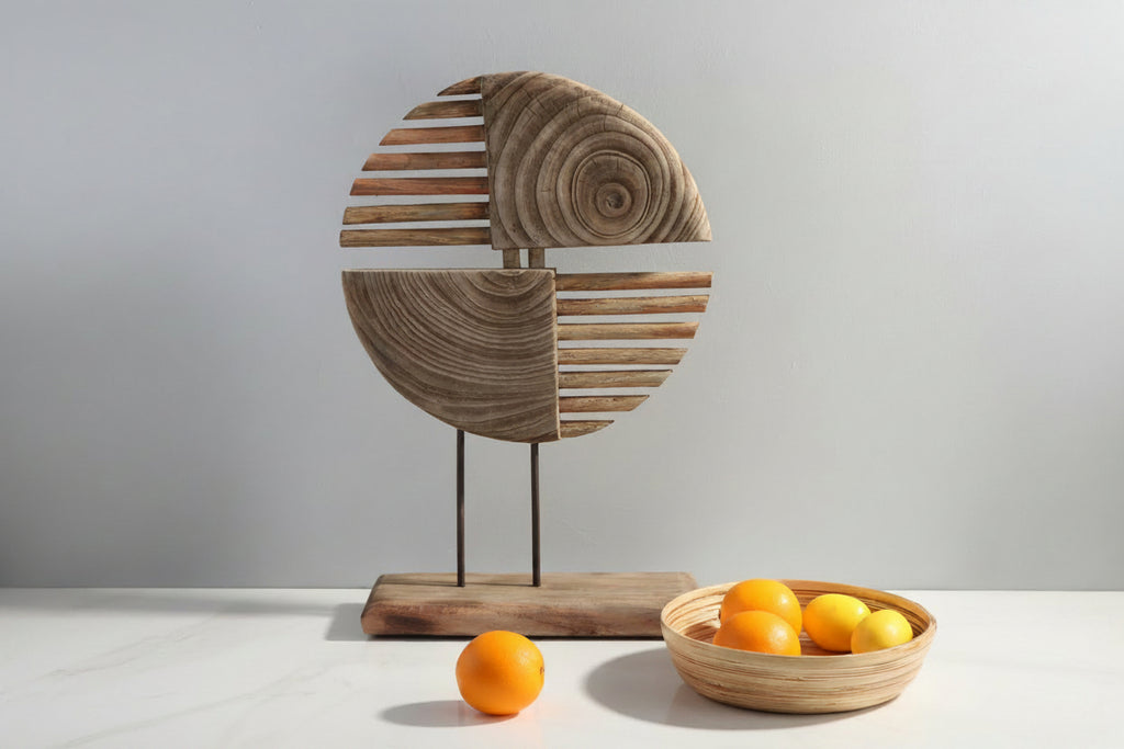 Wooden decorative piece with a bowl of oranges on a light background