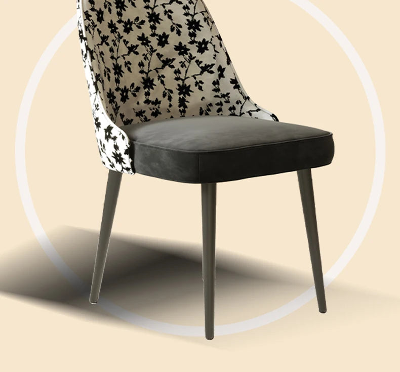 Chair with floral backrest and black seat on a beige background