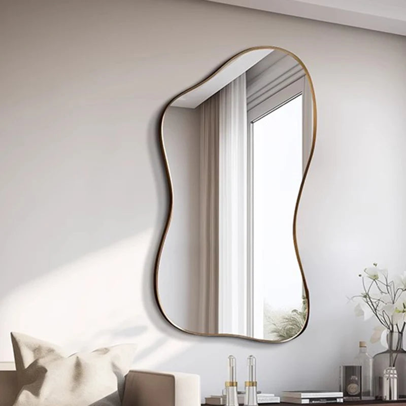 Modern wall mirror with wavy frame on a white wall