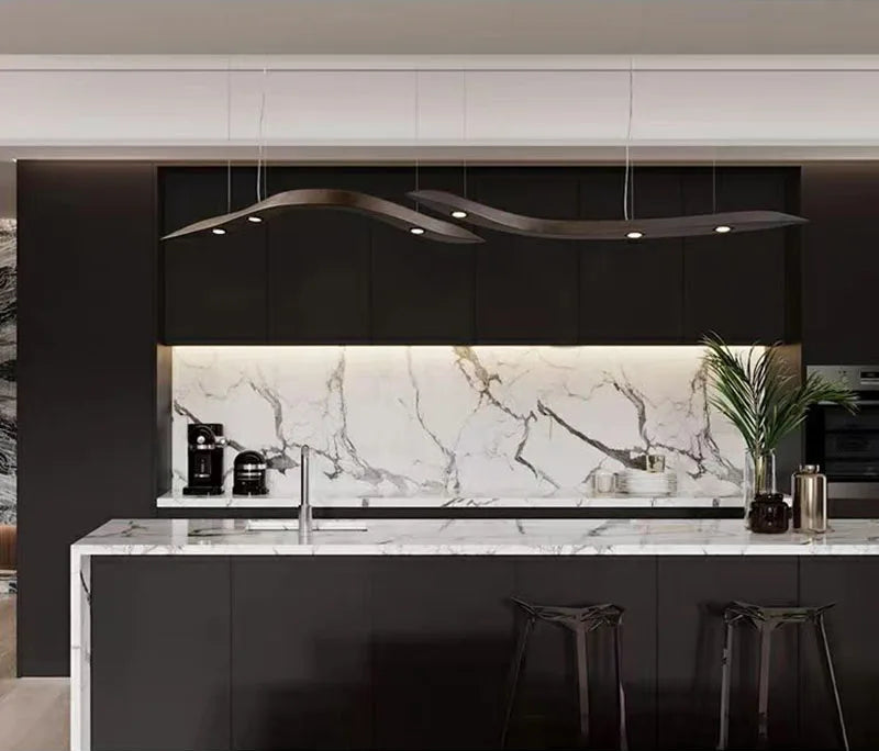 Modern kitchen with marble backsplash and black island