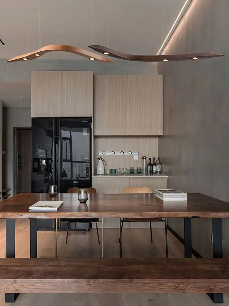 Modern kitchen with wooden dining table and cabinetry