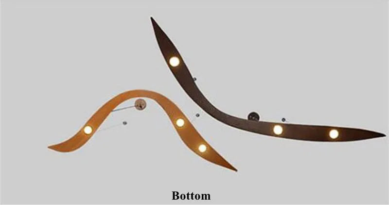 Modern ceiling light fixture with curved design on a plain background