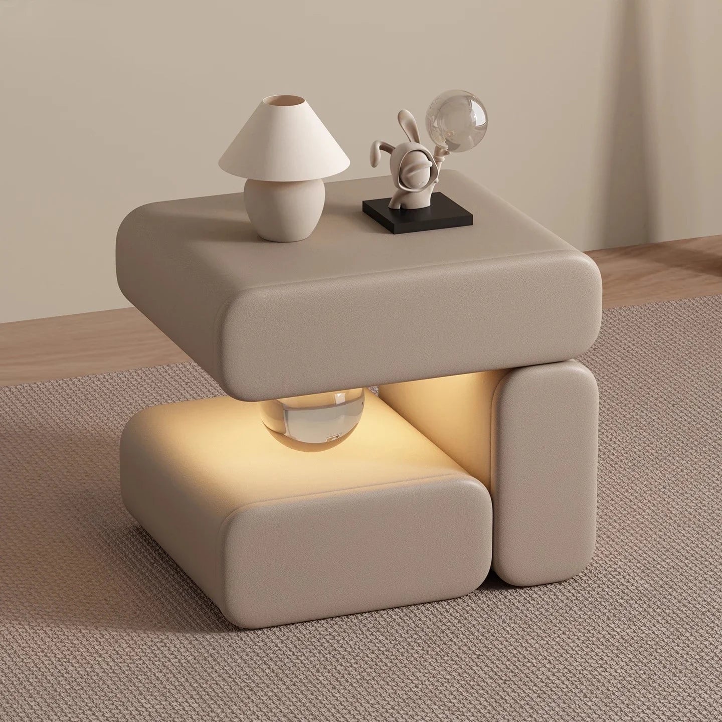 Beige side table with a lamp and decorative object on a neutral background