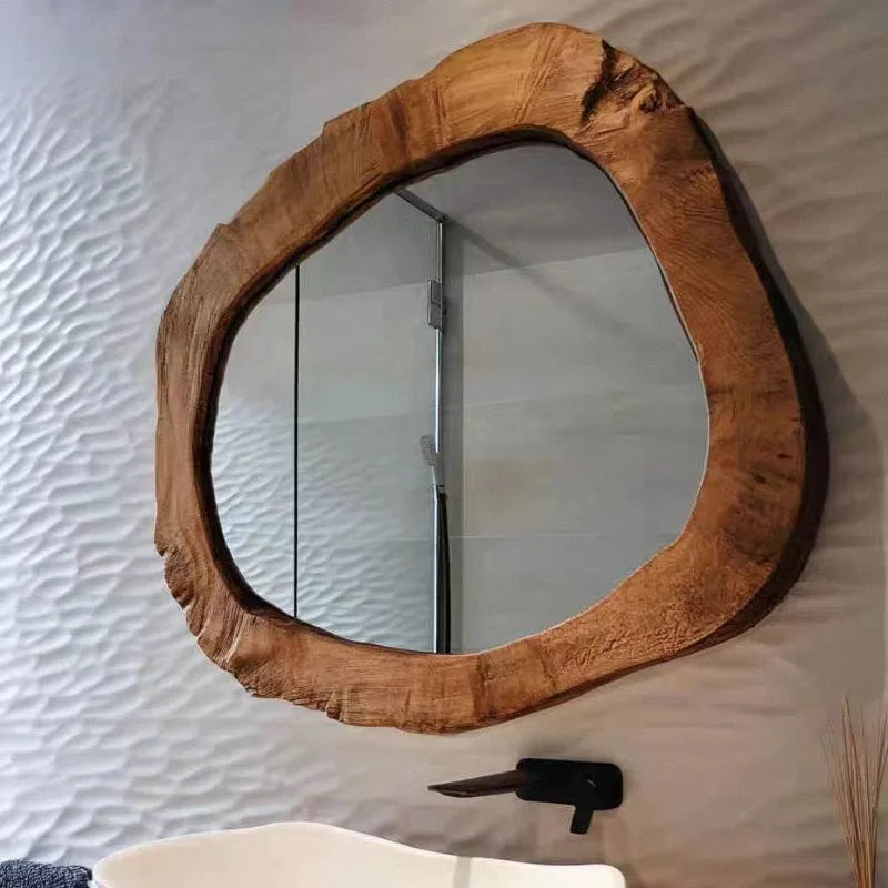 Wooden framed mirror on a textured wall