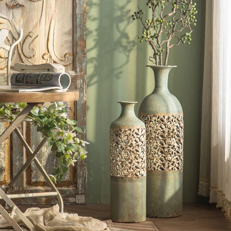 Decorative vases with intricate patterns in a room setting.
