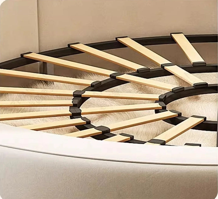 Wooden bed frame with metal support on a beige bed base
