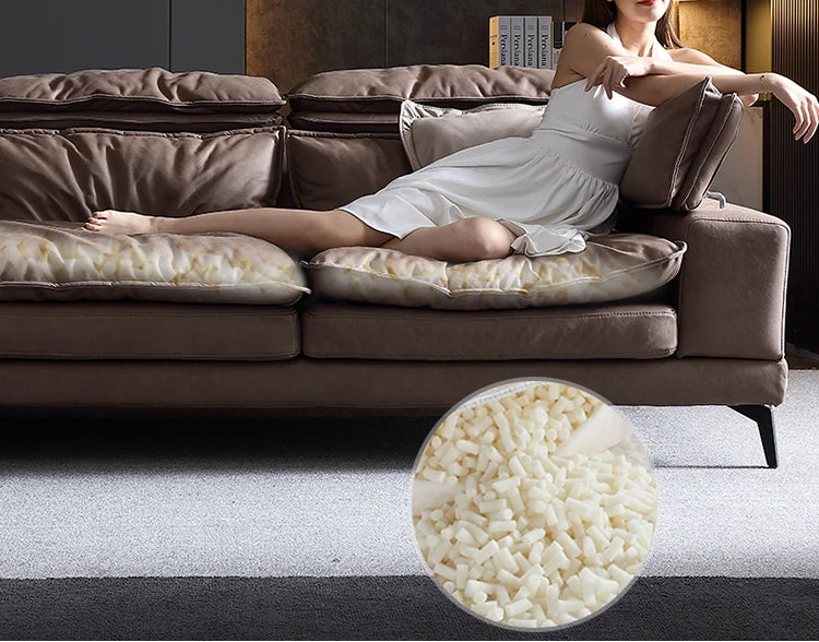 Woman lying on a brown sofa with a close-up of down filling.
