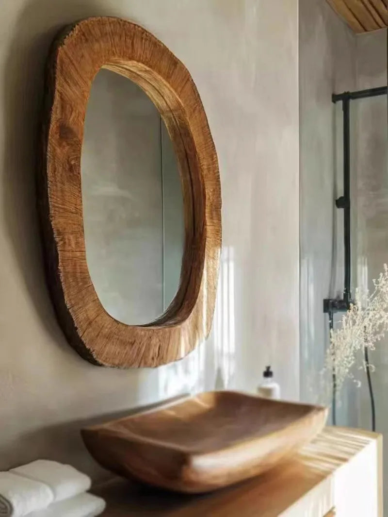 Wooden mirror and sink in a bathroom setting