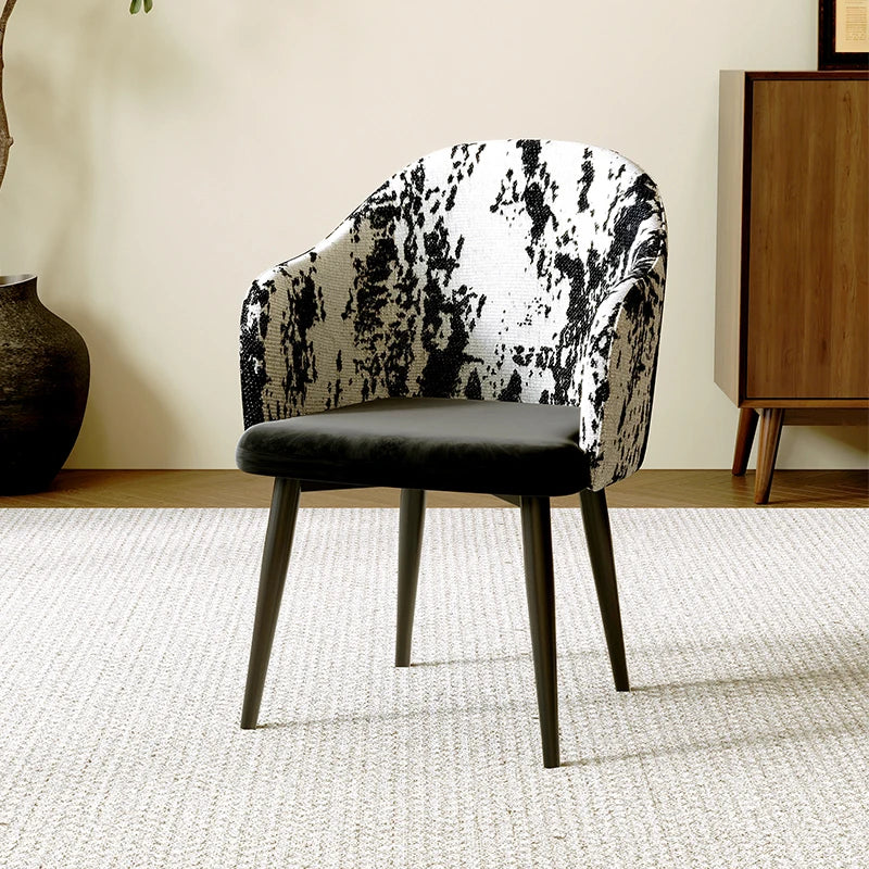 Chair with black and white patterned backrest in a room setting