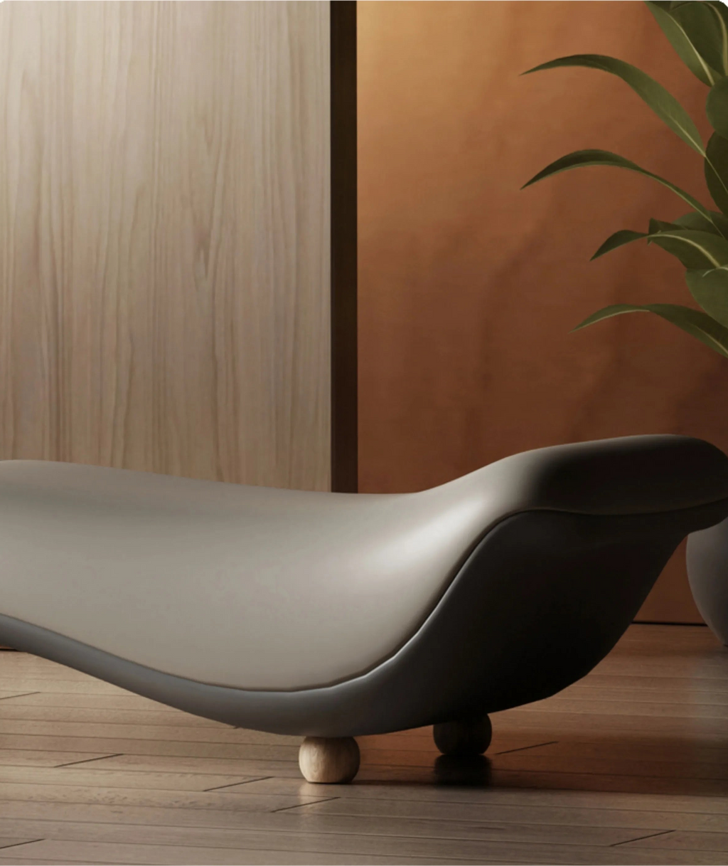 Modern gray bench against a wooden wall with a plant in the background
