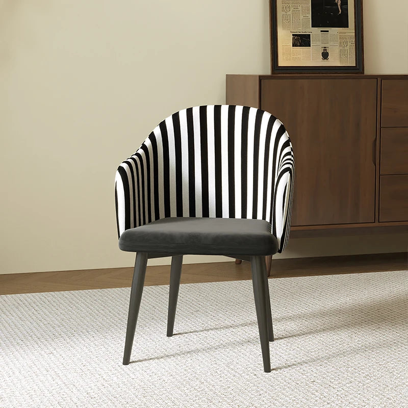 Chair with black and white striped backrest in a room setting