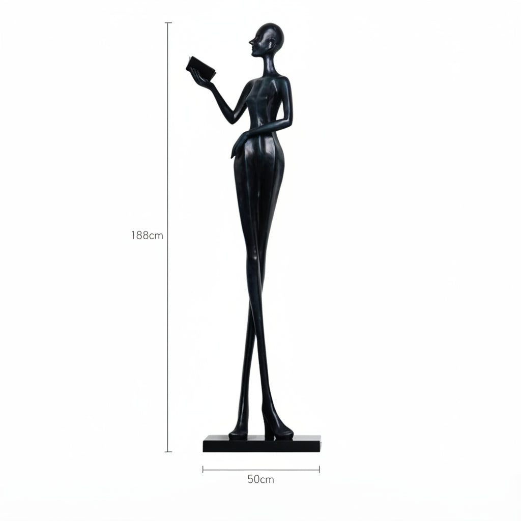 Black sculpture of a woman holding a book with dimensions on a white background